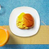 Two Eggs With Cheese On A Roll · Scrambled egg, cheddar cheese, served on a roll.