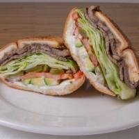 Carne Asada Sandwich · Grilled beef, beans, lettuce, tomatoes, jalapeños, cheese, onion, avocado, mayo.