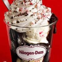 Peppermint Bark Dazzler Sundae · Served with Peppermint Bark ice cream layered with hot fudge, chocolate cookie pieces topped...