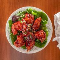 Korean Style Sweet And Spicy Chicken Wings · Spicy. 5 pieces. Tossed in gochujang based sauce.