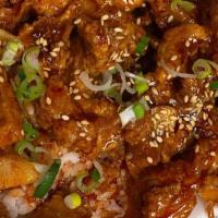 Spicy Garlic Chicken · Deep fried chicken chunks, sautéed in freshly grated garlic, and tossed in our sweet & spicy...
