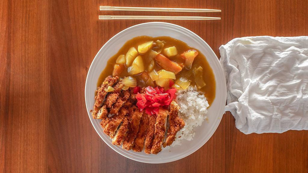 Chicken Katsu Curry Rice · Deep-fried panko-crusted chicken cutlet served with curry and white rice. Stew like curry with onions, carrots, and potatoes served over rice.