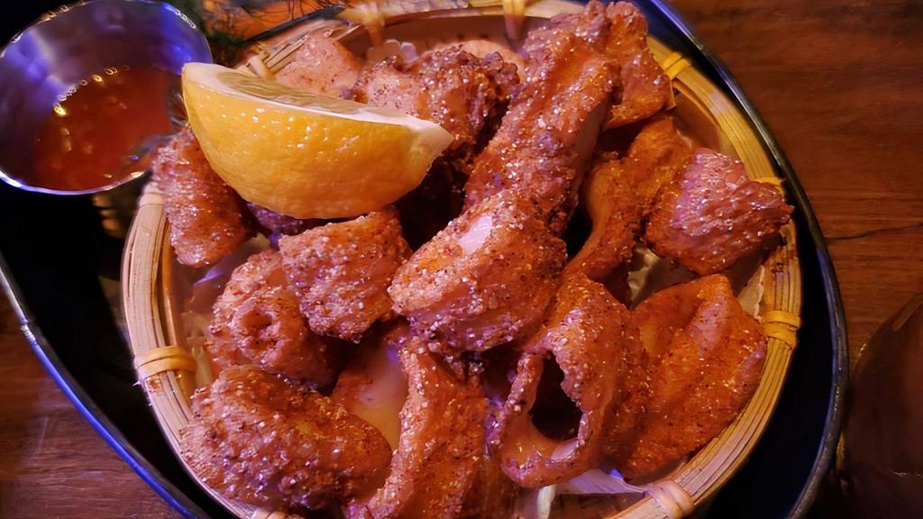 Crispy Fried Calamari · Crispy golden fried calamari w/ thai sweet chili sauce.