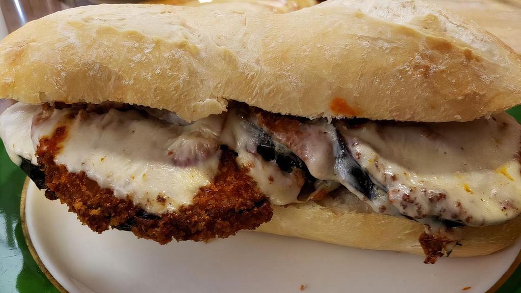 Eggplant Parm · Hand breaded eggplant topped with homemade sauce and mozzarella cheese.