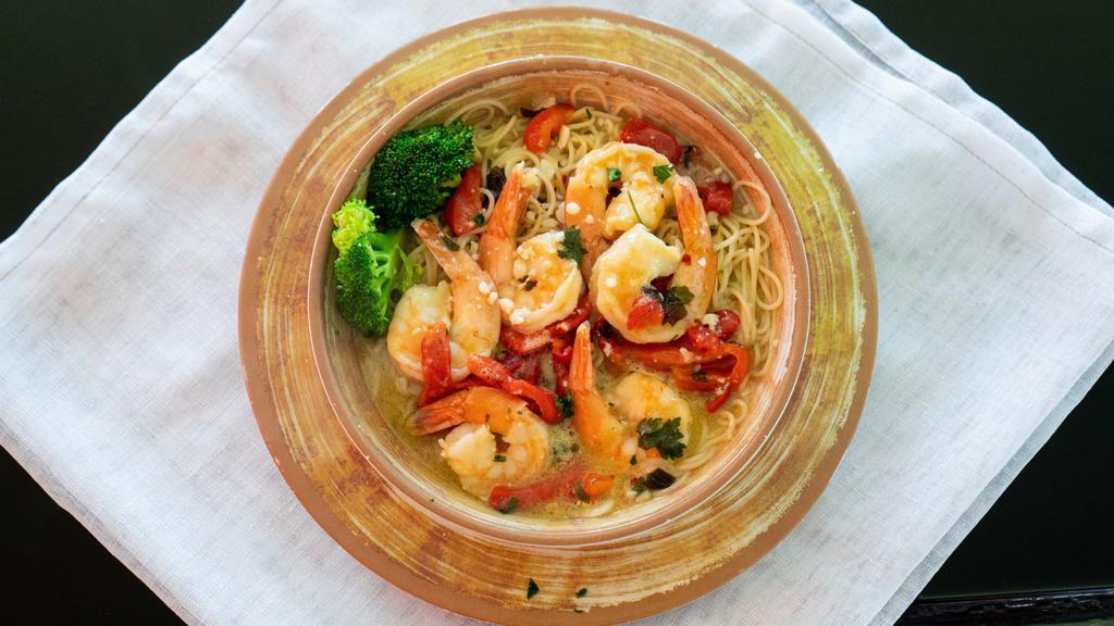 Shrimp Scampi · Jumbo shrimp served over a bed of linguine in a lemon butter wine sauce with fresh red peppers and broccoli.