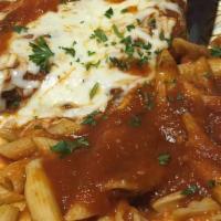Chicken Parmesan · Hand breaded chicken in homemade sauce, topped with mozzarella cheese, served with ziti.