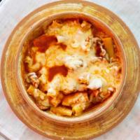 Baked Rigatoni · Rigatoni smothered in red sauce with mozzarella cheese and baked golden, topped with a meatb...