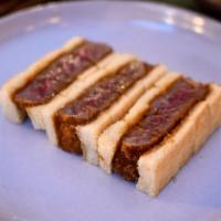 Japanese Wagyu Katsu Sando · Six-ounce A5 Japanese wagyu beef cutlet.