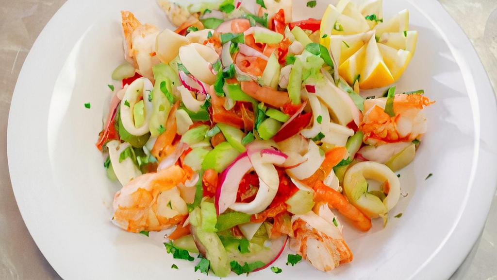 Seafood Salad · Shrimp, calamari, red onion, oregano & virgin olive oil.
