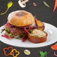 Funky Falafel Burger · Crisp falafel patty, Mediterranean style with fresh greens, pickles, shaved onions, Roma tom...
