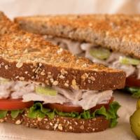 The Tuna Club Sandwich · A tasty sandwich of house made tuna salad, a sliced egg, sizzling bacon, fresh lettuce, and ...