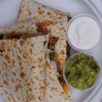 Super Quesadilla · A large flour tortilla with cheese, choice of meat. Served with pico de gallo, guacamole and...