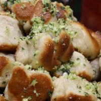 Garlic Knots · A classic snack, our garlic knots are strips of pizza dough tied in a knot, baked, and then ...