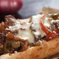 Philly Cheesesteak Roll · Baked roll filled with Sausage, cheese, and onions. Customizable to customer's preference.