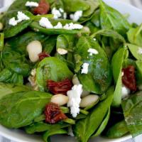 Spinach Salad · Fresh salad with vegetables and spinach, with a choice of dressing.
