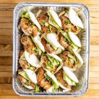 Crispy Chicken Buns · Per piece. Steamed buns filled with panko crusted chicken, iceberg lettuce, scallion, and cr...