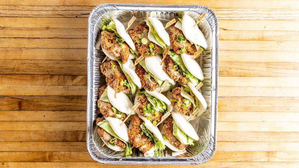 Crispy Chicken Buns · Per piece. Steamed buns filled with panko crusted chicken, iceberg lettuce, scallion, and creamy sesame sauce.
