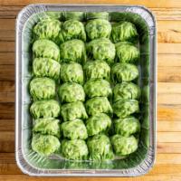 Edamame Dumplings · Vegan. Per piece. Boiled edamame, mushrooms, and chinese chives in spinach wrappers.