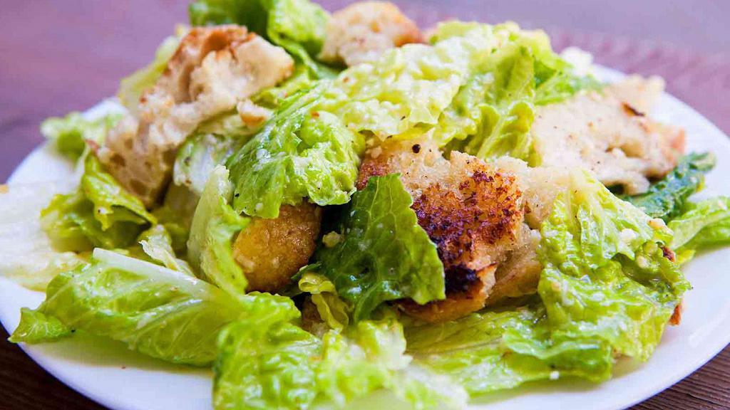 Caesar Salad · House croutons, parmigiano, and Caesar dressing.