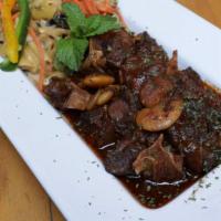 Oxtail · Slow-cooked, savory, fall off the bone oxtail with gravy