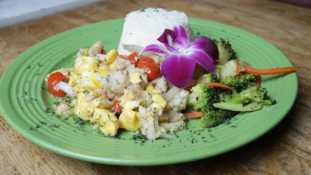 Ackee & Saltfish · Native Jamaican dish prepared with salted codfish, ackee, onions, tomatoes, red bell pepper and hearty spices