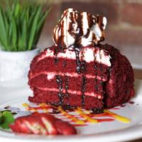 Red Velvet Cake · Soft, buttery, crimson red velvet cake topped with cream cheese icing