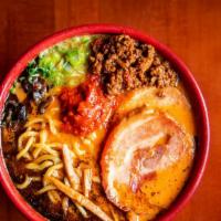Spicy Miso Ramen · Pork broth and red and white miso served with thick noodles topped with chashu pork jowl, gr...