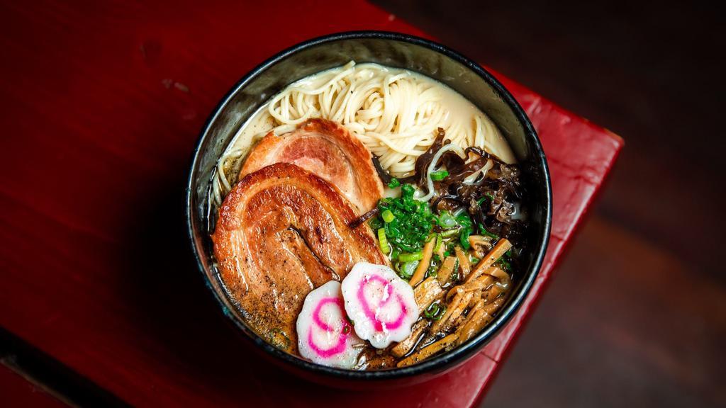 Tonkotsu Ramen · Pork broth served with thin noodles topped with chashu pork jowl, kikurage, menma, scallions, black garlic oil.
