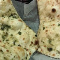Garlic Naan · North Indian baked flat bread infused with a nice garlicy flavor.