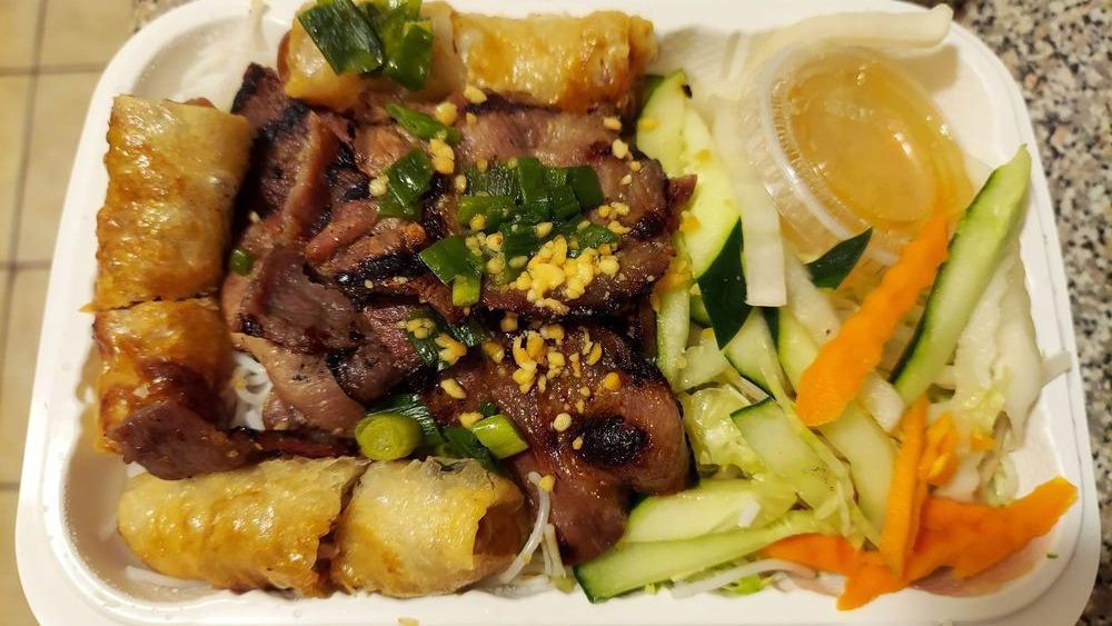 . Bun Cha Gio Thit Nuong · Spring Rolls and Grilled Pork with Lettuce on Rice Vermicelli.