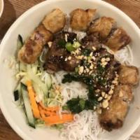 . Bun Cha Gio Bo Lui · Grilled Beef and Spring Roll with sesame seasoning Lettuce on Rice Vermicelli.