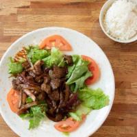 . Bo Luc Lac · Marinated beef cubes sauteed with Salad.