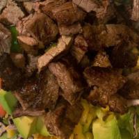 Taco Salad (Chicken Or Steak ) · Lettuce, purple cabbage, tomato, purple onion, corn, avocado, peppers, cilantro, topped with...