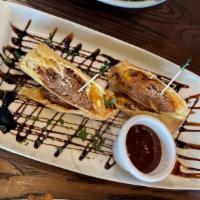 Cheesesteak Spring Rolls · Caramelized onions, American cheese and spicy balsamic ketchup.