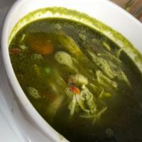 Aguadito De Pollo · Cilantro chicken soup, with peas, and carrots. Served with garlic rice.