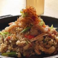 Chaufa De Pollo · Gluten.Chinese style fried rice with our signature rotisserie chicken, bacon, snow peas, gin...