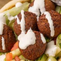 Falafel Gyro · Falafel with lettuce tomatoes and your choice of sauce.