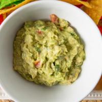 Guacamole Al Molcajete · Freshly made a la vista. Avocados, jalapenos, tomatoes, onions, lime and cilantro. Served wi...