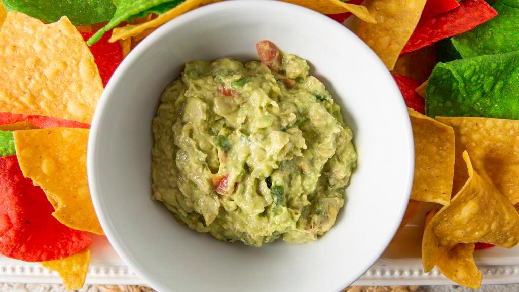 Guacamole Al Molcajete · Freshly made a la vista. Avocados, jalapenos, tomatoes, onions, lime and cilantro. Served with warm tortilla chips and salsa sauce.
