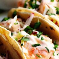Baja Tacos · Select fish of the day or grilled shrimp on flour tortillas with shredded cabbage, pico de g...