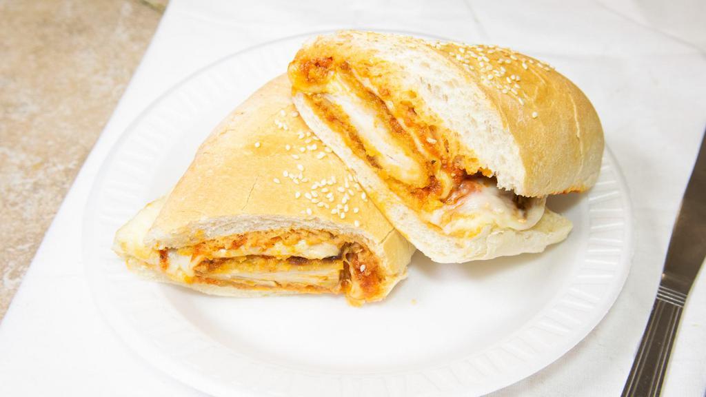 Chicken Parmigiana Sandwich · Comes with grated Romano and Mozzarella cheese.
