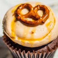 Caramel Crunch · Chocolate cake with caramel frosting topped with sea salt and pretzels.