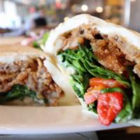 Eggplant Wrap · Fried Eggplant with roasted peppers, spinach, fresh mozzarella, and garlic mayo.