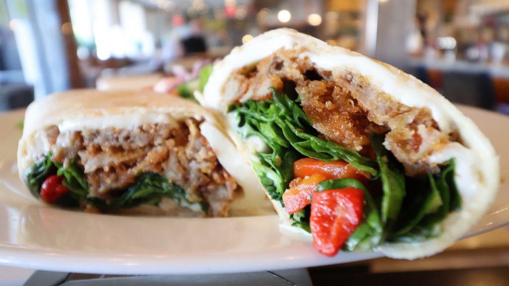 Eggplant Wrap · Fried Eggplant with roasted peppers, spinach, fresh mozzarella, and garlic mayo.