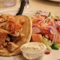 Chicken Souvlaki · Grilled Chicken, Greek Dressing, Feta Cheese, Red onion, mixed greens.