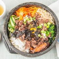 Dol Sot Bibim Bob · Assorted vegetables,beef, and fried egg laid over white rice in hot stone bowl. Served with ...
