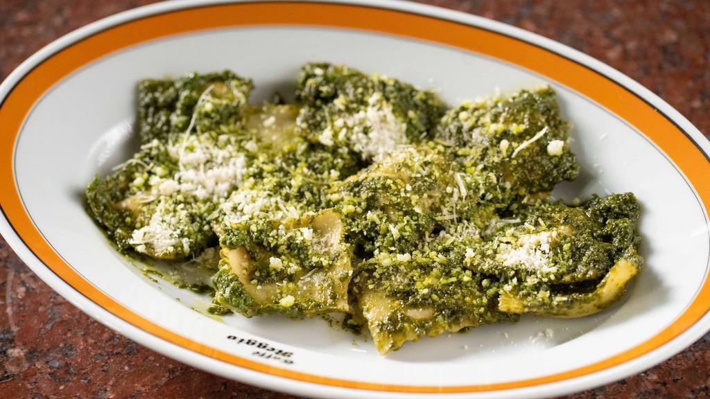 Ravioli Al Pesto · Ravioli al pesto ravioli with ricotta and spinach, with our homemade pesto sauce: basil, pignoli nots, parmagiano and garlic in olive oil.