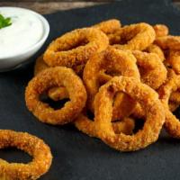 Crispy Onion Rings · Our thick-cut onion rings are made from whole white onions, battered with a subtle blend of ...