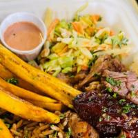Chipotle Pork Bowl · Chipotle pork served with side rice 'n beans, fried ripe plantains, and a savory coleslaw