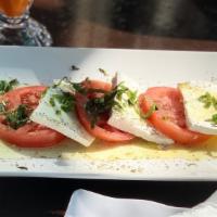 Caprese · Fresh mozzarella tomato & olive oil